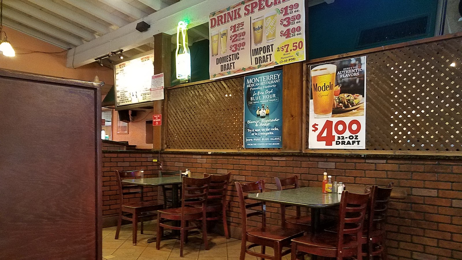 The dining room with brick walls and wood tables